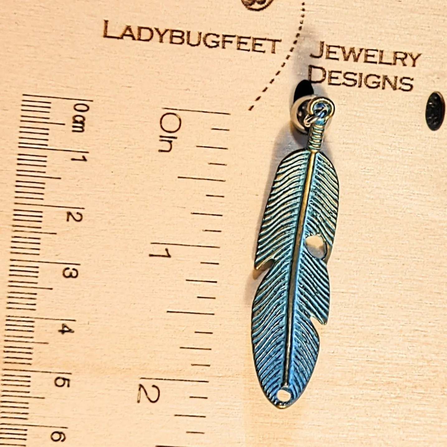 Blue Patina Curved Feather Pendant