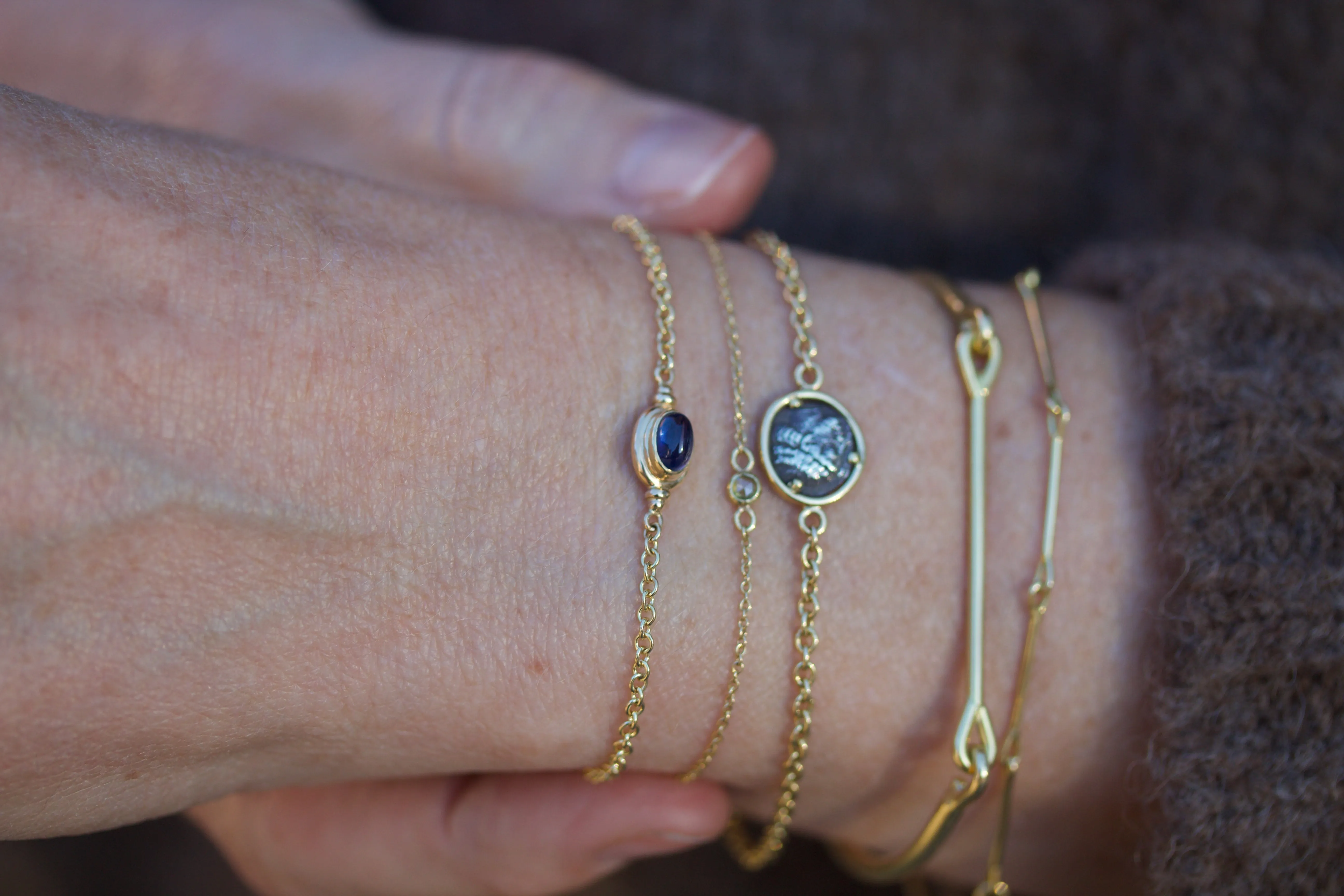 Captured Bracelet with Cabochon Cut Blue Sapphire